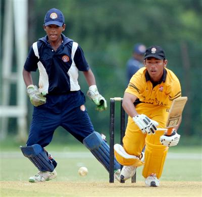 IN DEFENSIVE MODE: Malaysian batsman Fikri Makram Rosdi in action against Sri Lanka in last year's final. Sri Lanka won by four wickets.